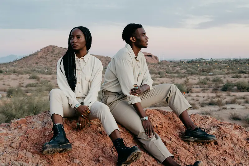 Two models in relaxed camel and ecru layers